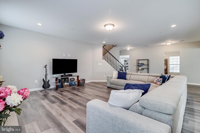 13301 Windjammer Ct, Hughesville, MD 20637 - living room with stairway, baseboards, and wood finished floors