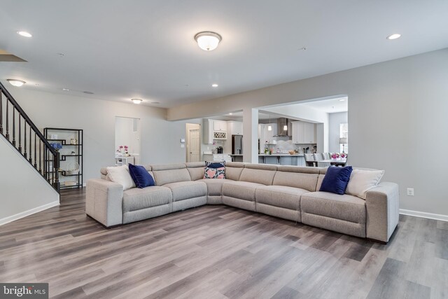 13301 Windjammer Ct, Hughesville, MD 20637 - living area with baseboards, wood finished floors, recessed lighting, and stairway