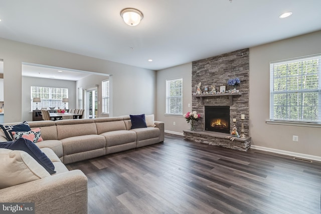 13301 Windjammer Ct, Hughesville, MD 20637 - living area featuring plenty of natural light, a stone fireplace, visible vents, and dark wood finished floors