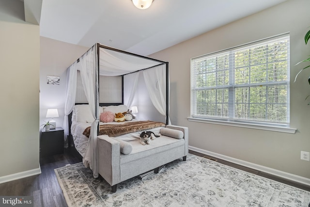 13301 Windjammer Ct, Hughesville, MD 20637 - bedroom featuring wood finished floors, baseboards, and multiple windows