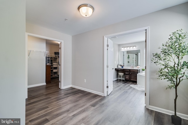 13301 Windjammer Ct, Hughesville, MD 20637 - bedroom featuring ensuite bathroom, baseboards, a spacious closet, a closet, and dark wood-type flooring