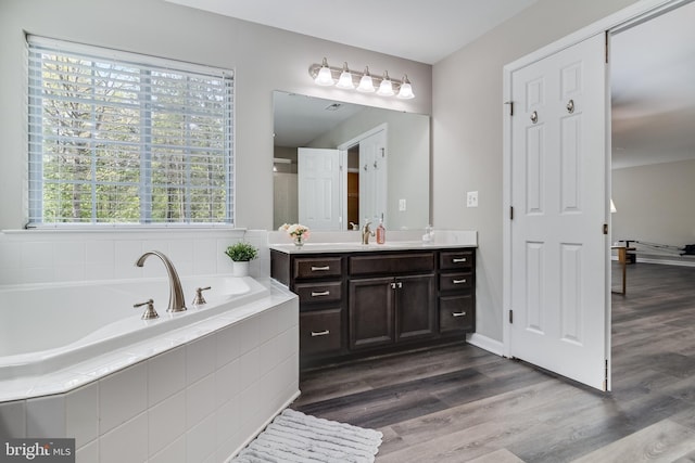 13301 Windjammer Ct, Hughesville, MD 20637 - full bathroom featuring a bath, wood finished floors, and vanity