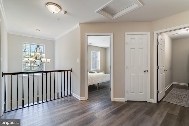 13301 Windjammer Ct, Hughesville, MD 20637 - hallway featuring baseboards, an inviting chandelier, ornamental molding, and dark wood finished floors