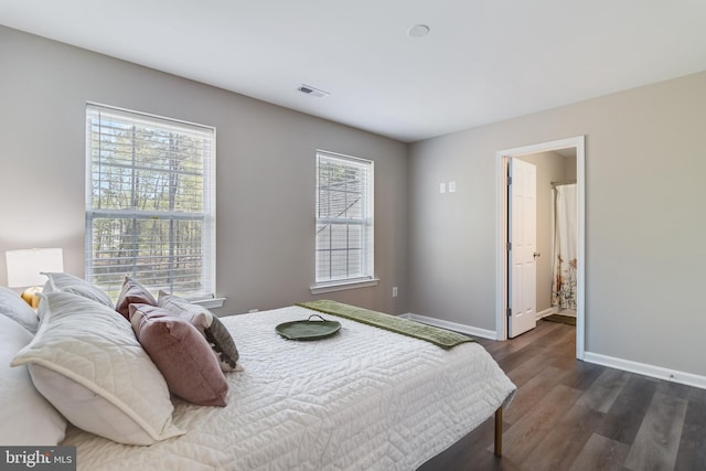 13301 Windjammer Ct, Hughesville, MD 20637 - bedroom with baseboards, dark wood-style flooring, and visible vents