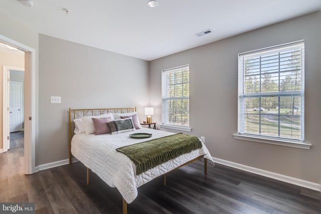 13301 Windjammer Ct, Hughesville, MD 20637 - bedroom with baseboards, visible vents, and dark wood-style floors