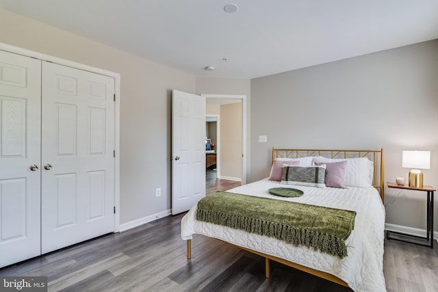 13301 Windjammer Ct, Hughesville, MD 20637 - bedroom with baseboards, wood finished floors, and a closet