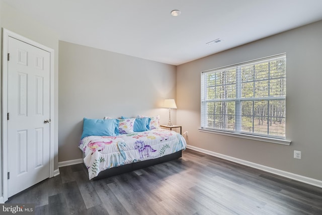 13301 Windjammer Ct, Hughesville, MD 20637 - bedroom featuring wood finished floors, visible vents, and baseboards