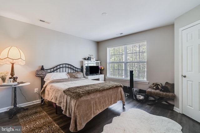 13301 Windjammer Ct, Hughesville, MD 20637 - bedroom with baseboards, wood finished floors, and visible vents