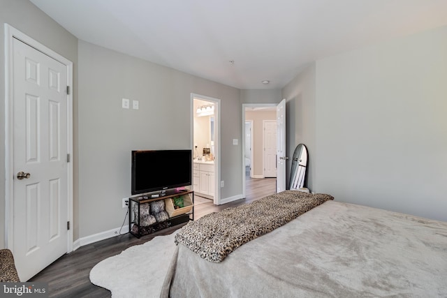 13301 Windjammer Ct, Hughesville, MD 20637 - bedroom featuring wood finished floors, baseboards, and ensuite bathroom