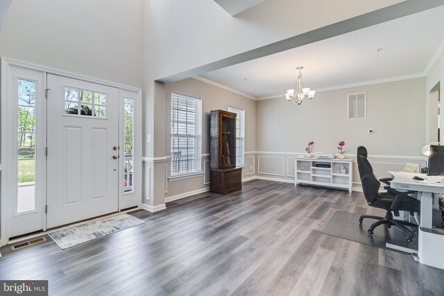 13301 Windjammer Ct, Hughesville, MD 20637 - entrance foyer featuring wood finished floors, visible vents, an inviting chandelier, and crown molding