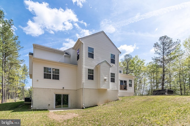 13301 Windjammer Ct, Hughesville, MD 20637 - back of house with brick siding and a yard