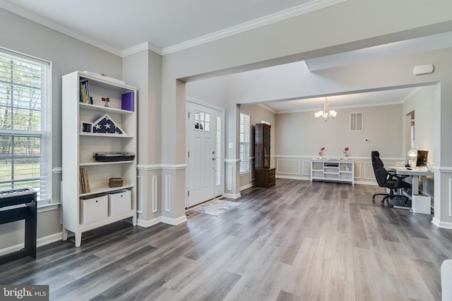 13301 Windjammer Ct, Hughesville, MD 20637 - office space with a notable chandelier, wood finished floors, and a healthy amount of sunlight