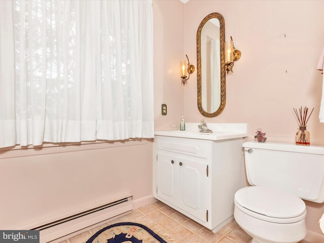 half bath featuring vanity, a baseboard radiator, tile patterned floors, and toilet