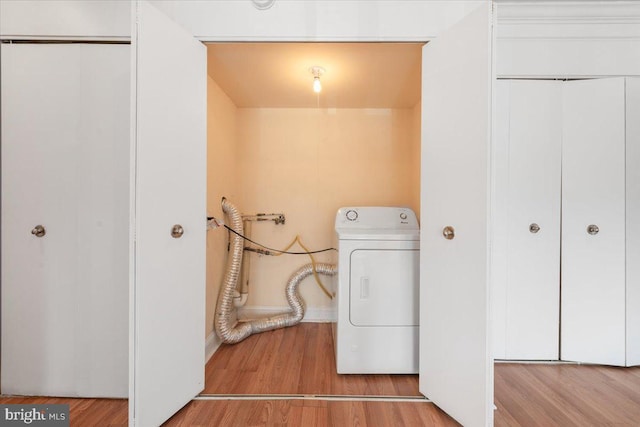 washroom featuring washer / clothes dryer and wood finished floors
