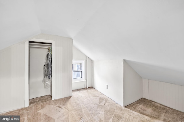 bonus room with carpet and lofted ceiling