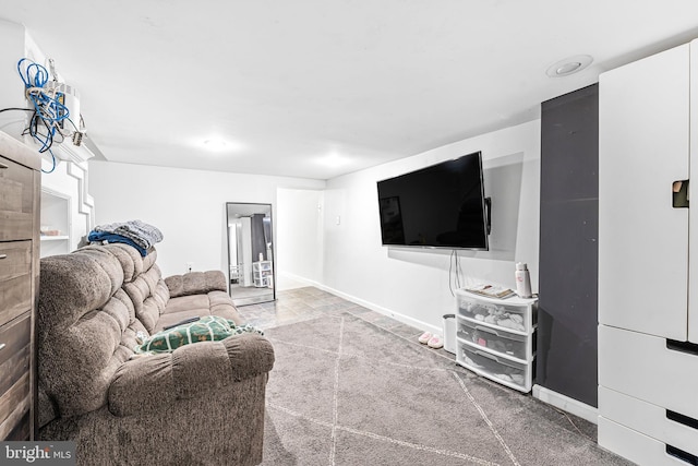 living area featuring baseboards