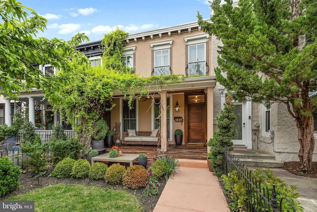 1227 S St NW, Washington, DC 20009 - italianate house featuring a porch and stucco siding