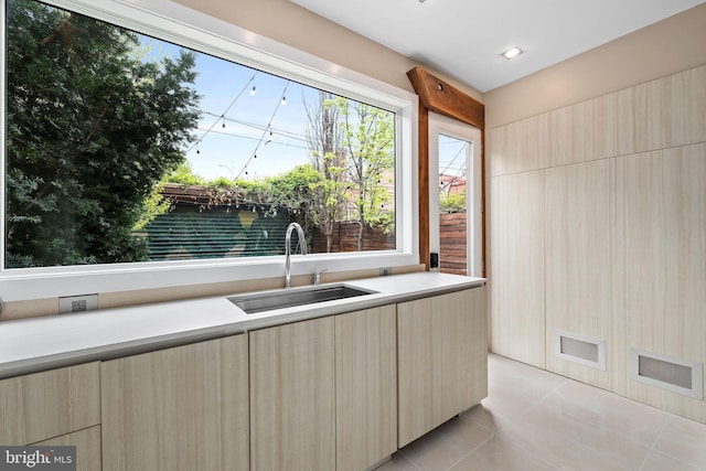 1227 S St NW, Washington, DC 20009 - kitchen with light countertops, light tile patterned floors, modern cabinets, and a sink