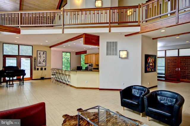 6525 76th St, Cabin John, MD 20818 - living area featuring a towering ceiling and baseboards