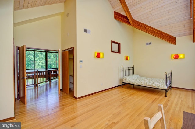 6525 76th St, Cabin John, MD 20818 - bedroom featuring wood ceiling with exposed beams, high vaulted ceiling, baseboards, and light wood-style floors