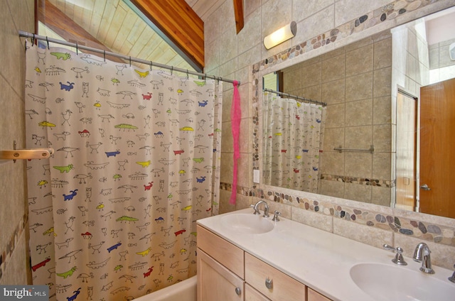 6525 76th St, Cabin John, MD 20818 - bathroom featuring double vanity, shower / bath combo, and decorative backsplash