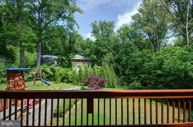 6525 76th St, Cabin John, MD 20818 - wooden terrace featuring a playground and a lawn