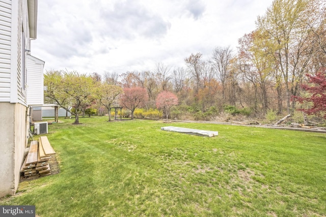 view of yard featuring central AC