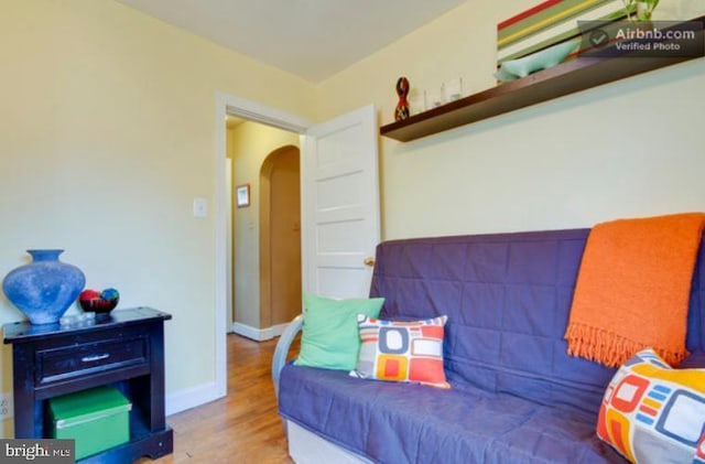 5010 54th Pl, Hyattsville, MD 20781 - bedroom with arched walkways, wood finished floors, and baseboards