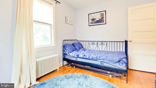 5010 54th Pl, Hyattsville, MD 20781 - bedroom with radiator heating unit and wood finished floors