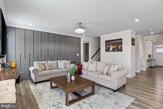living room featuring crown molding, stairway, recessed lighting, and wood finished floors