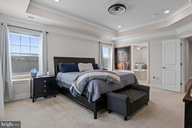 bedroom featuring a tray ceiling, light colored carpet, multiple windows, and visible vents