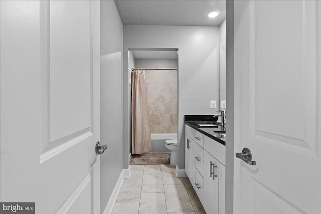 full bathroom with tile patterned flooring, toilet, vanity, and shower / bath combination with curtain