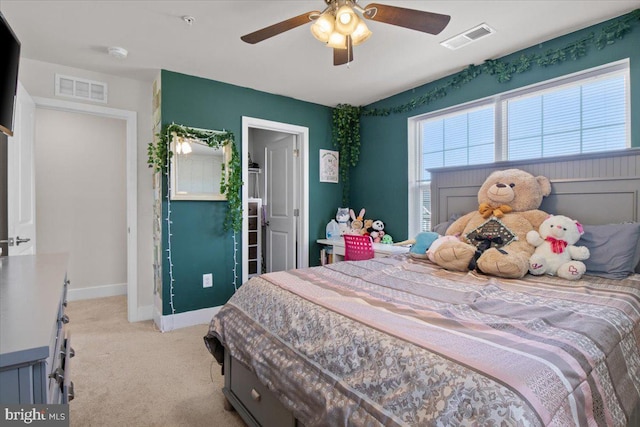 carpeted bedroom with baseboards, multiple windows, and visible vents