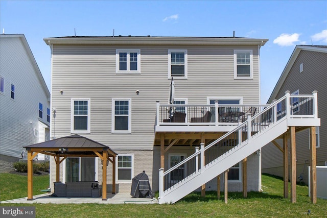 back of property featuring a patio, a gazebo, a deck, and stairs