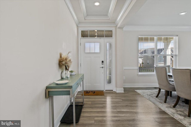 foyer entrance with dark wood-type flooring, crown molding, baseboards, and recessed lighting