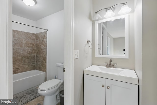 full bath with toilet, vanity, and shower / tub combination