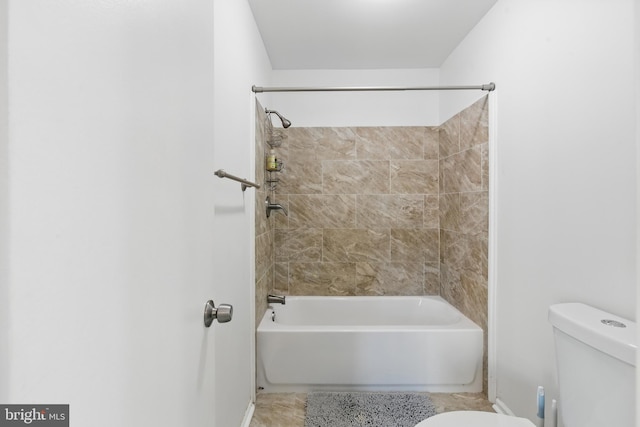 full bath with toilet, shower / bath combination, and baseboards