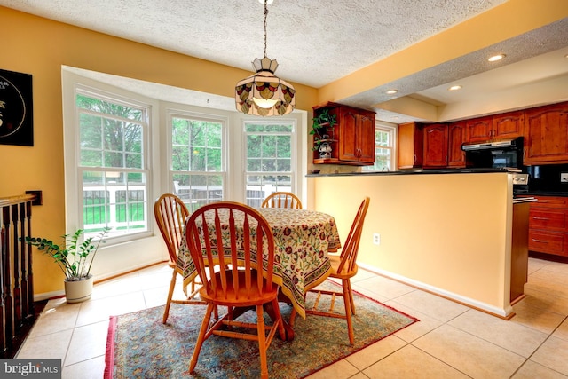 dining space with baseboards, a textured ceiling, recessed lighting, and light tile patterned floors