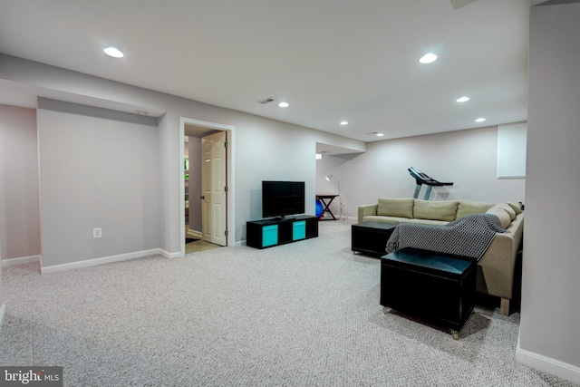 living room featuring baseboards, carpet floors, and recessed lighting