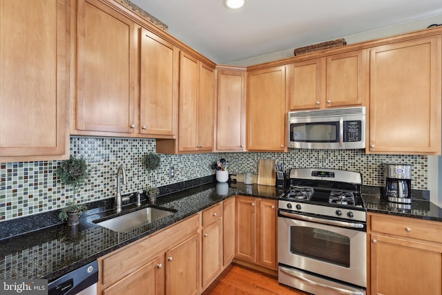 2 N Commerce Sq Unit 303, Trenton, NJ 08691 - kitchen with dark stone countertops, backsplash, appliances with stainless steel finishes, and a sink
