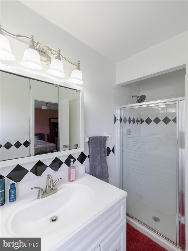 45 Shelley Rd, Southampton, PA 18966 - ensuite bathroom featuring tasteful backsplash, a stall shower, connected bathroom, and vanity