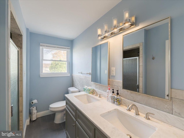 45 Shelley Rd, Southampton, PA 18966 - bathroom with double vanity, toilet, a stall shower, and a sink