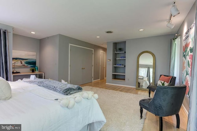 1 Fox Field Ct, Reisterstown, MD 21136 - bedroom featuring light wood finished floors, arched walkways, recessed lighting, baseboards, and visible vents