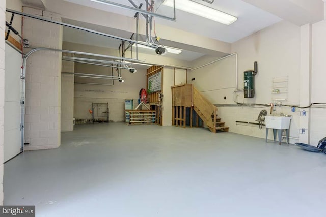 1 Fox Field Ct, Reisterstown, MD 21136 - garage with a garage door opener, a sink, and concrete block wall