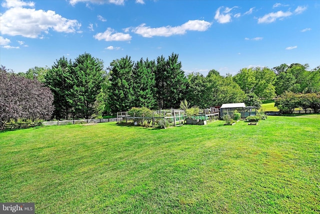 1 Fox Field Ct, Reisterstown, MD 21136 - view of yard featuring fence, an outbuilding, a greenhouse, and a vegetable garden