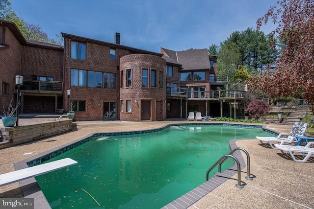 1 Fox Field Ct, Reisterstown, MD 21136 - outdoor pool with a diving board and a patio area