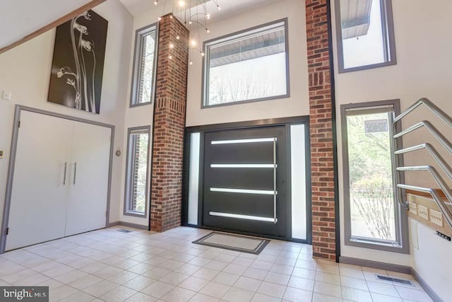 1 Fox Field Ct, Reisterstown, MD 21136 - foyer featuring tile patterned flooring, baseboards, a towering ceiling, and visible vents