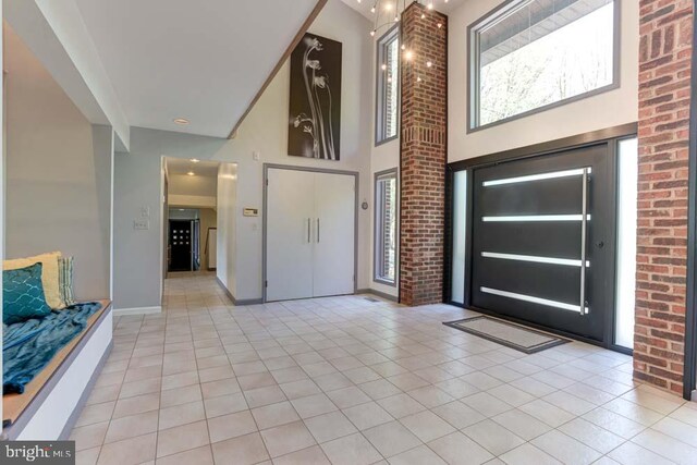 1 Fox Field Ct, Reisterstown, MD 21136 - entryway with light tile patterned floors, baseboards, and a towering ceiling