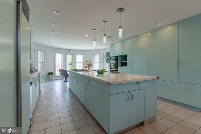 1 Fox Field Ct, Reisterstown, MD 21136 - kitchen with light tile patterned floors, light countertops, freestanding refrigerator, recessed lighting, and oven