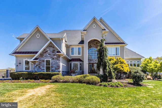 4083 Reels Mill Rd, Frederick, MD 21704 - view of front of home with stone siding, stucco siding, a standing seam roof, and a front lawn